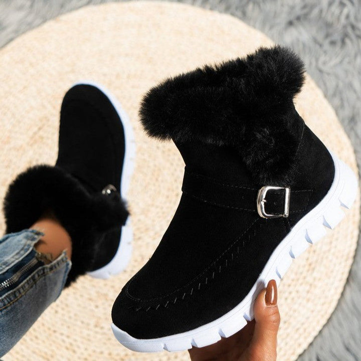 Adaline fur collar suede ankle boots in black, top-down view held in hand