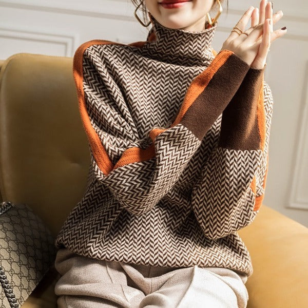 Adalyn herringbone turtleneck sweater styled with earrings, front view