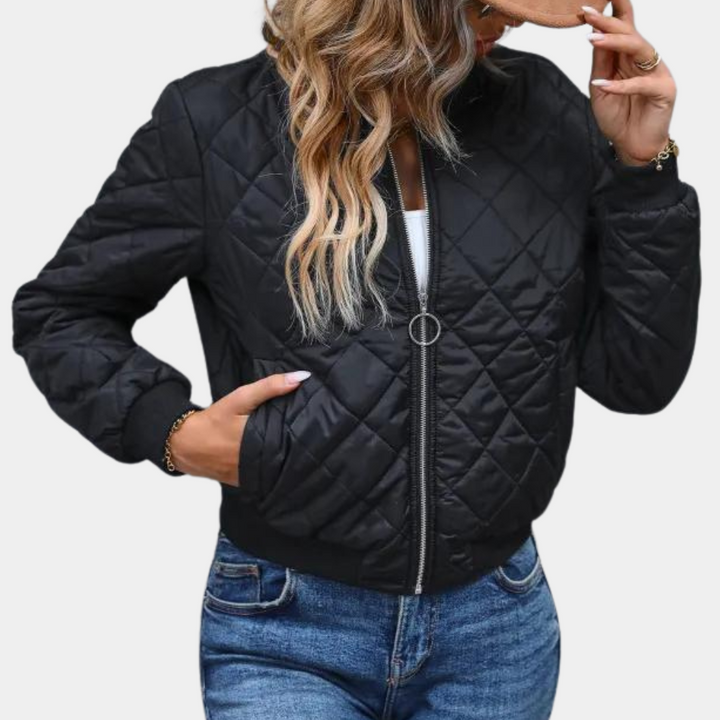 Adalyn quilted bomber jacket with hand in pocket, front view