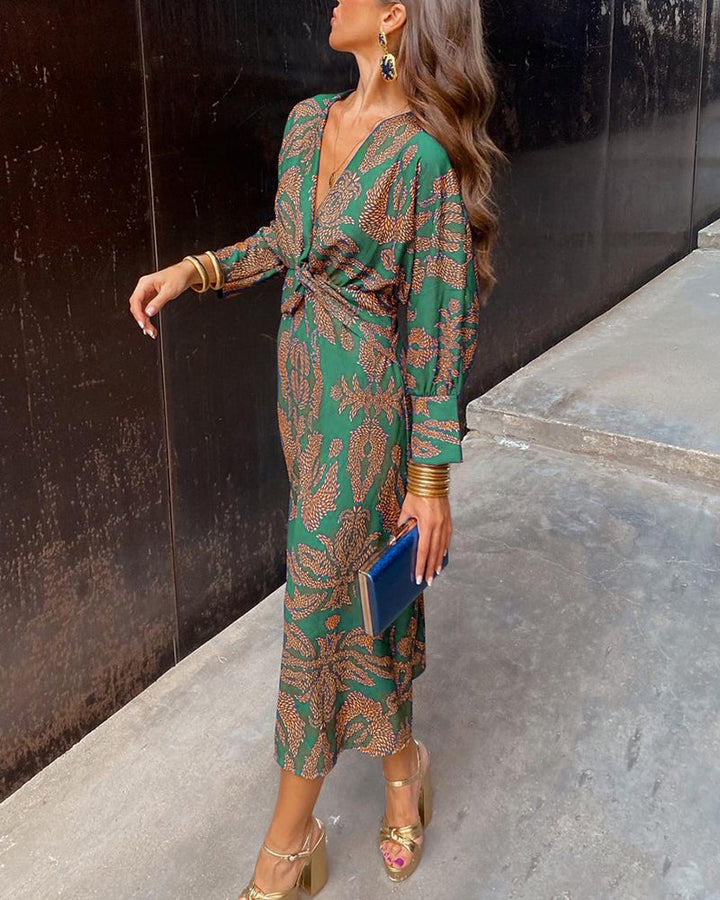 Adeline twist-front maxi dress in a green and rust botanical print, side view