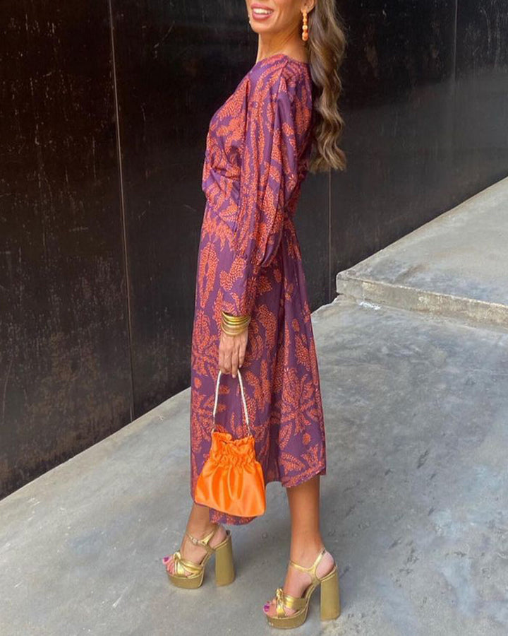 Adeline twist-front maxi dress in a purple and orange botanical print, back view