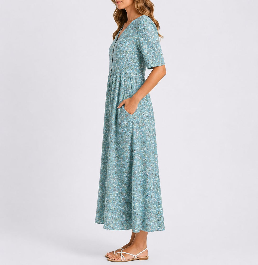 Adeline floral midi dress with side pockets, side profile view