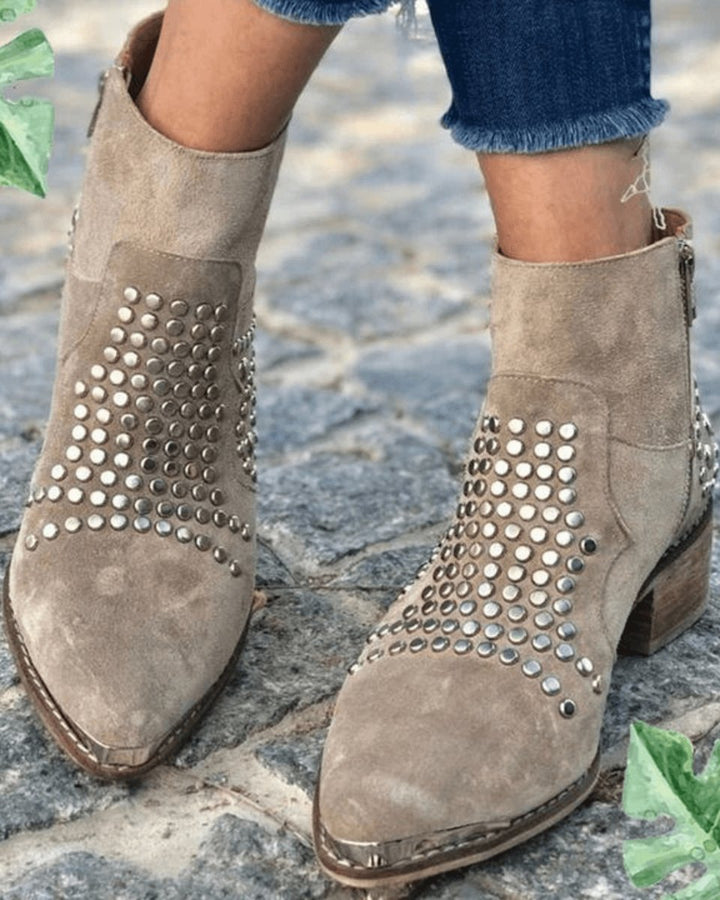 Adeline studded pointed toe ankle booties with block heel, front view on model