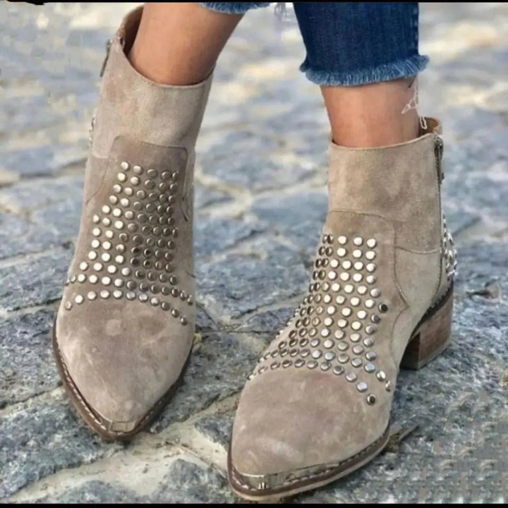Adeline studded pointed toe booties, front view on model walking