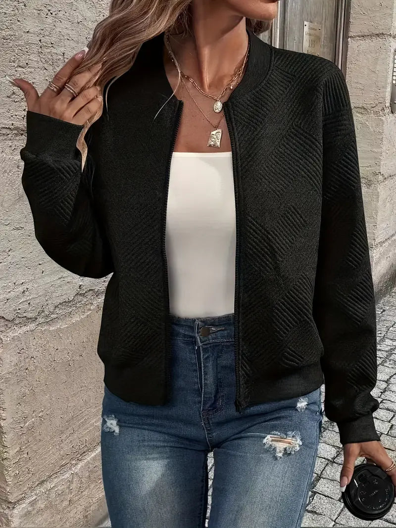 Adeline textured zip-up bomber jacket in black, front view with coffee cup