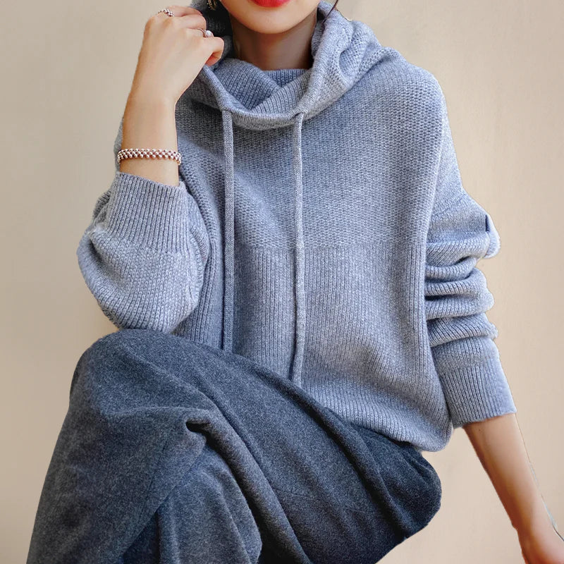 Amara cowl neck hooded sweater in gray, seated view