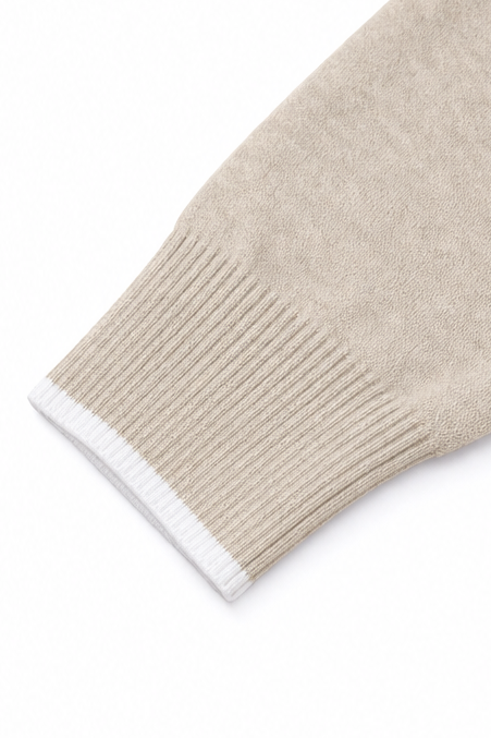 Annalise V-neck knit sweater styled with jeans and ankle boots, indoor scene