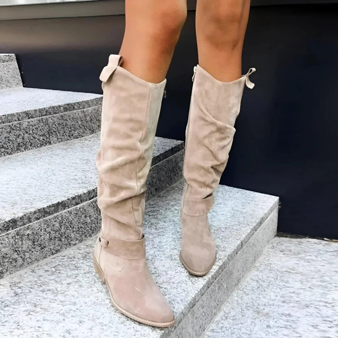 Anneliese slouch boots worn on stairs, close-up styling shot