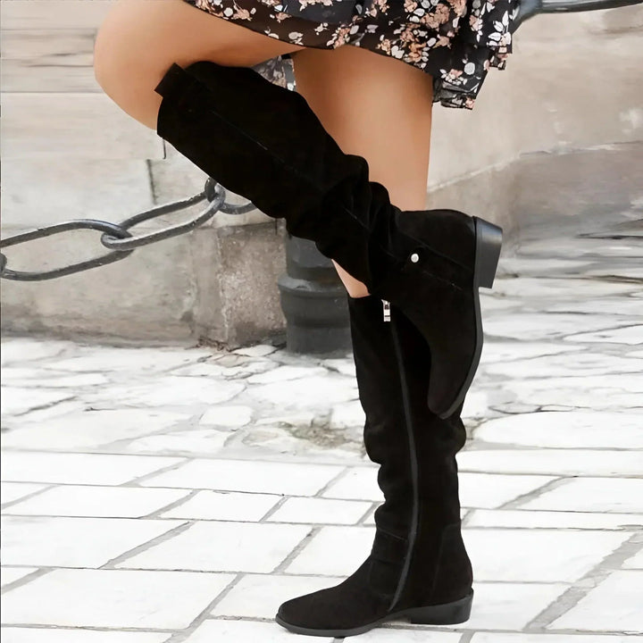 Anneliese black slouch boots walking shot, side view
