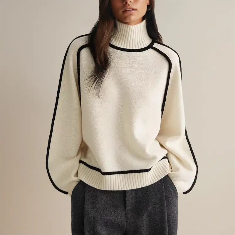 Beatrix contrast trim turtleneck fall sweater in white, front view with wool trousers