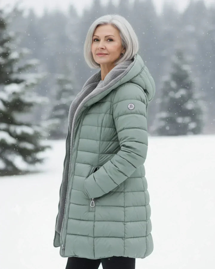 Beatrix hooded long puffer jacket in black, front view outdoors