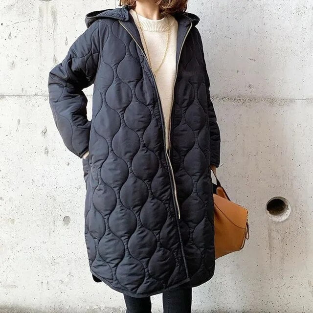 Beatrix quilted hooded longline parka in black, front view with bag