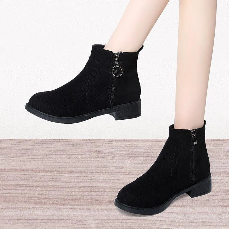 Bettina black ankle boots with chunky block heel, walking view