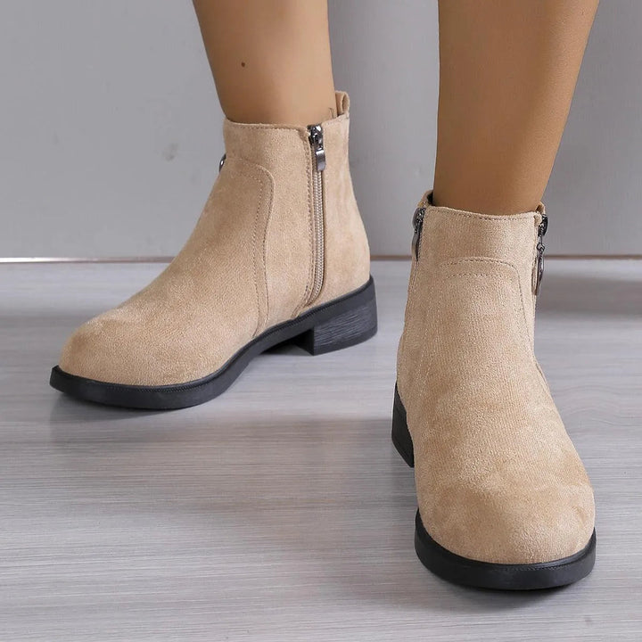 Bettina black ankle boots with chunky block heel, walking view