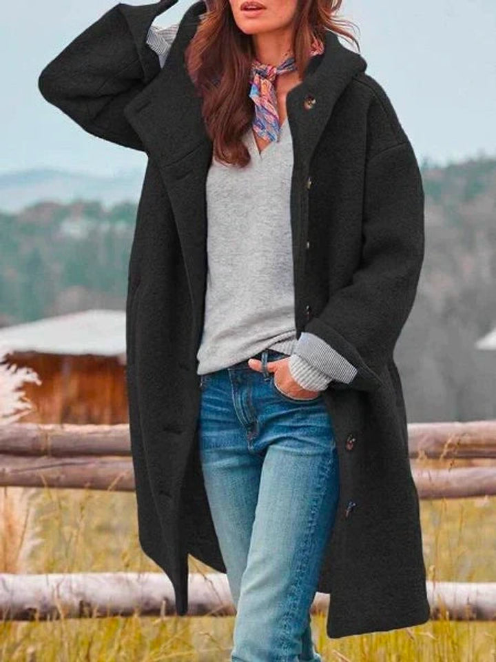 Camille hooded button-front fleece coat in black, close-up front detail