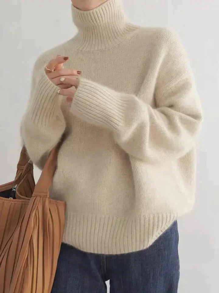 Camille cream turtleneck sweater with tote bag, close up