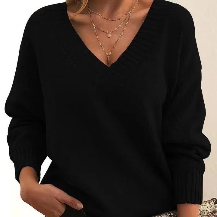 Cassandra oversized V-neck knit sweater in black, front close-up view