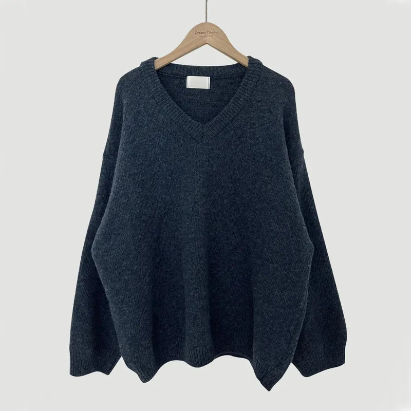Cassandra V-neck ribbed trim sweater in dark gray, front view on hanger