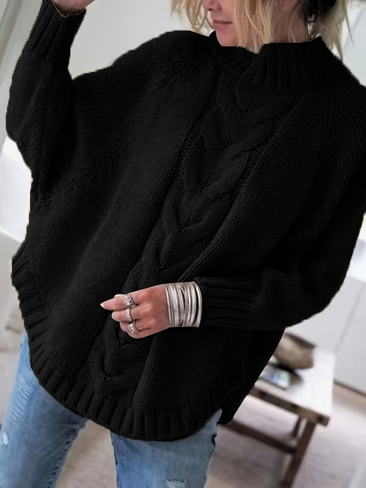Colette oversized cable-knit sweater in black, front view close up