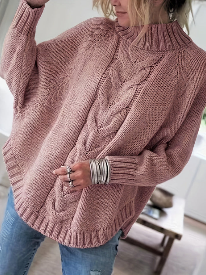 Colette oversized cable-knit sweater in pale pink, front view close up