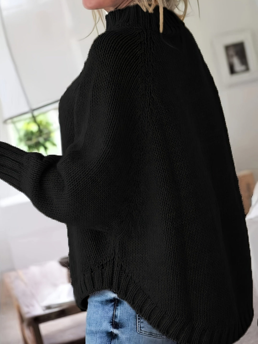 Colette oversized cable-knit sweater in black, side view