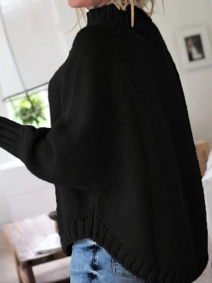 Colette oversized cable-knit sweater in black, side view