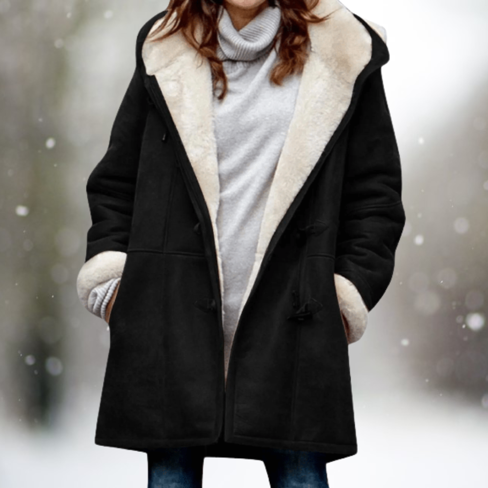 Corinne hooded shearling jacket in black, front view with hands in pockets