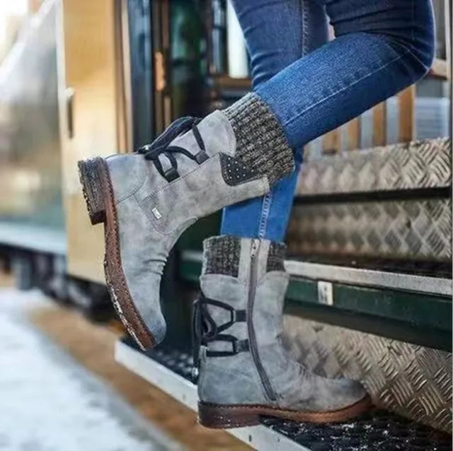 Corinne lace-up mid-calf boots in gray, both feet crossed view