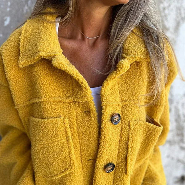 Delphine teddy coat close-up on model, front button and collar detail