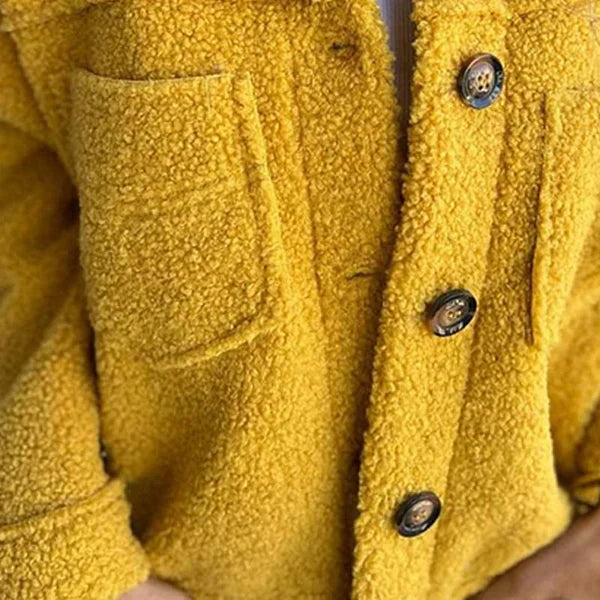Delphine teddy coat pocket and button detail close-up