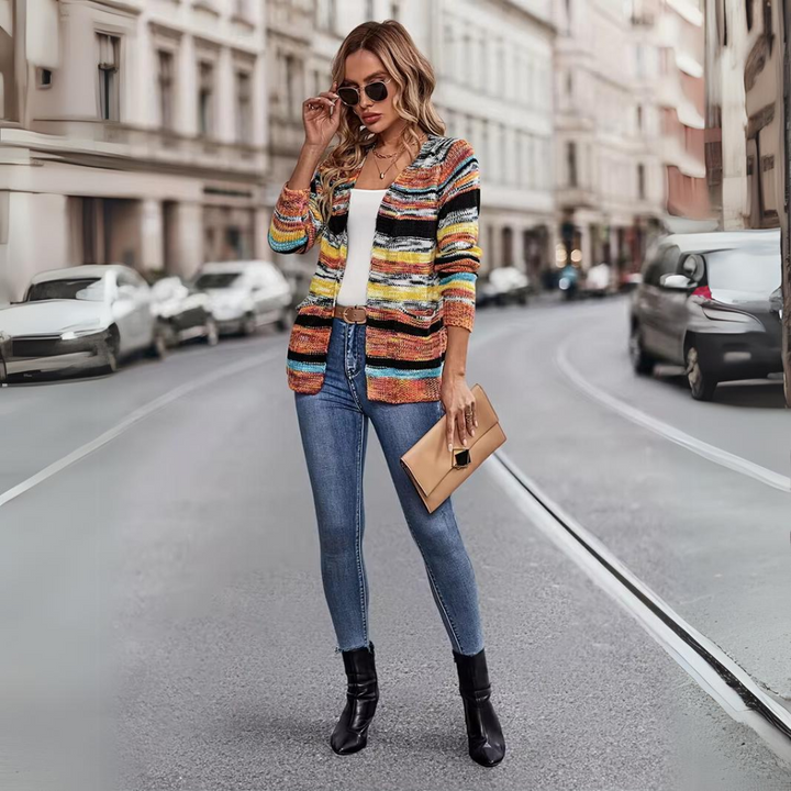 Delphine striped open front cardigan worn with jeans and sunglasses, full body street style view
