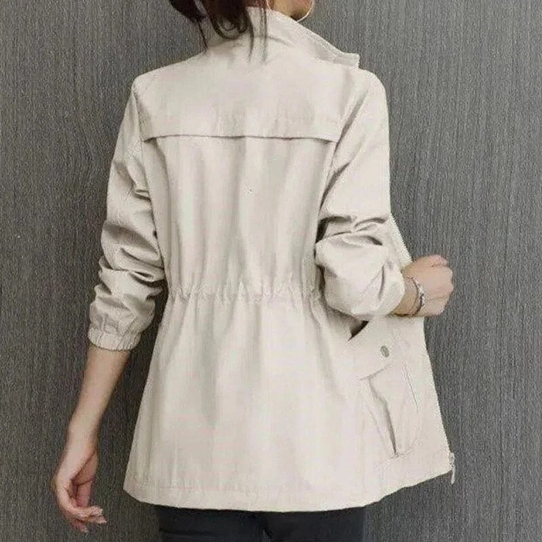 Delphine bomber jacket in beige, back view with cargo pockets