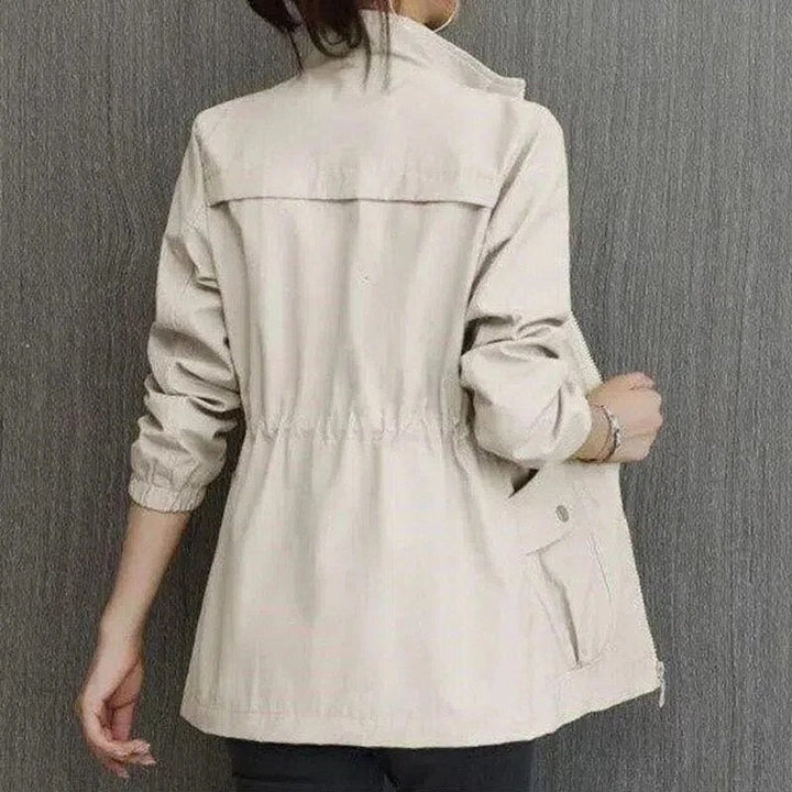 Delphine bomber jacket in beige, back view with cargo pockets