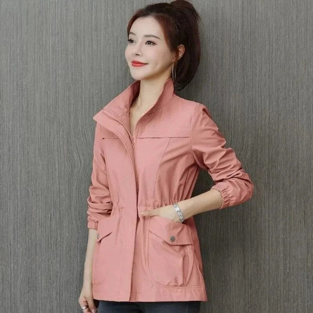 Delphine bomber jacket in pink, side view with hand in pocket
