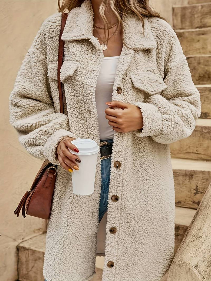 Fenwick teddy coat close-up of button front and flap pockets
