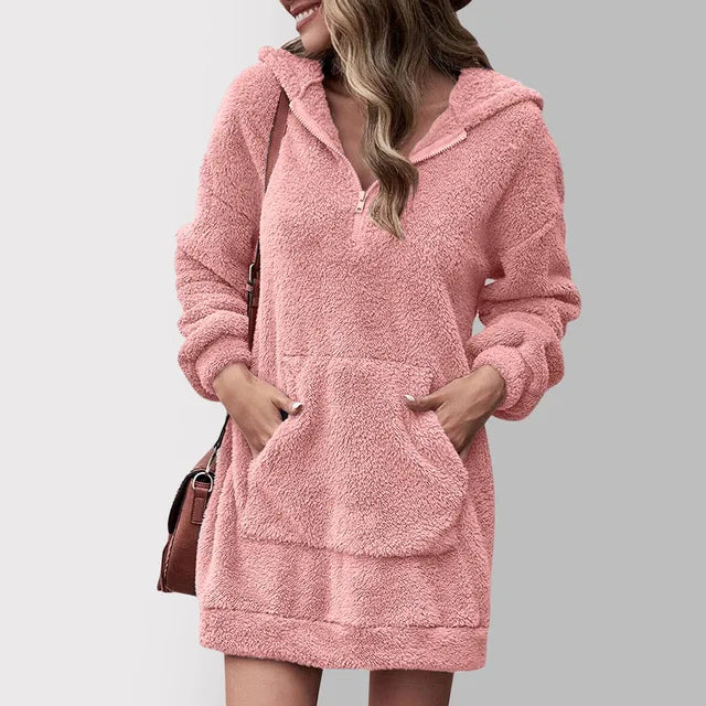 Fenwick pink hooded zip sweater mini dress, front view with hands in pocket