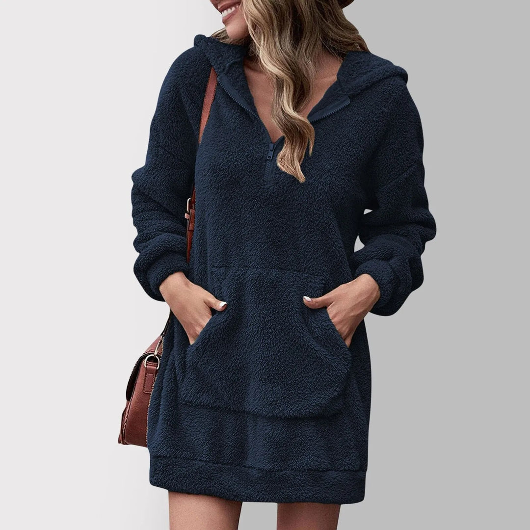 Fenwick dark blue hooded zip sweater mini dress, front view with handbag