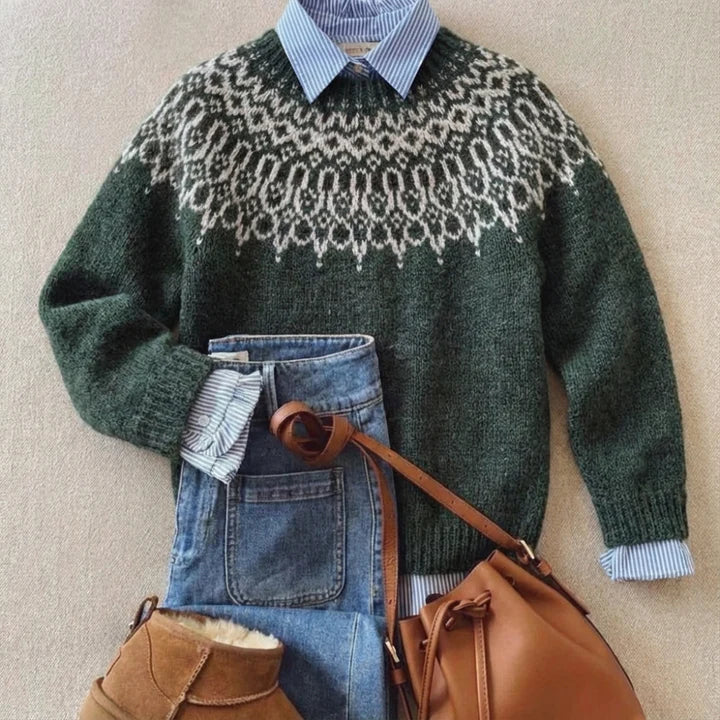 Fenwick Nordic pattern crew neck knit sweater styled with denim jeans and a striped collared shirt, flat lay