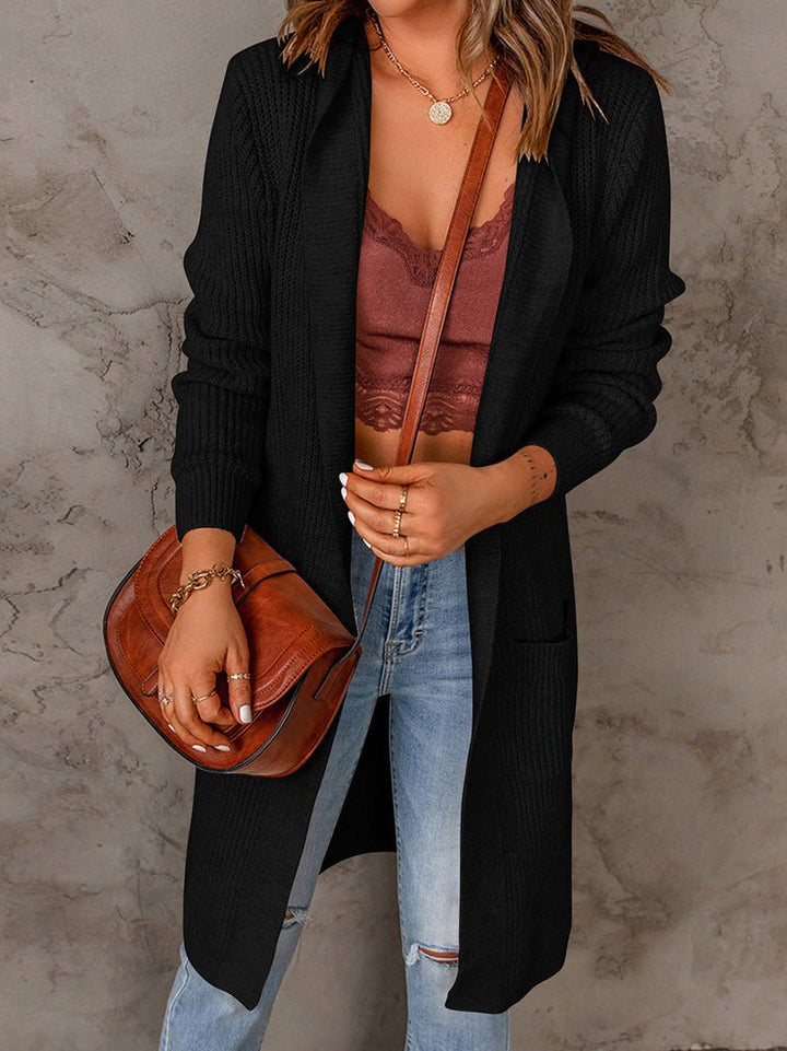 Fenwick open front long cardigan in black, close-up front view with crossbody bag