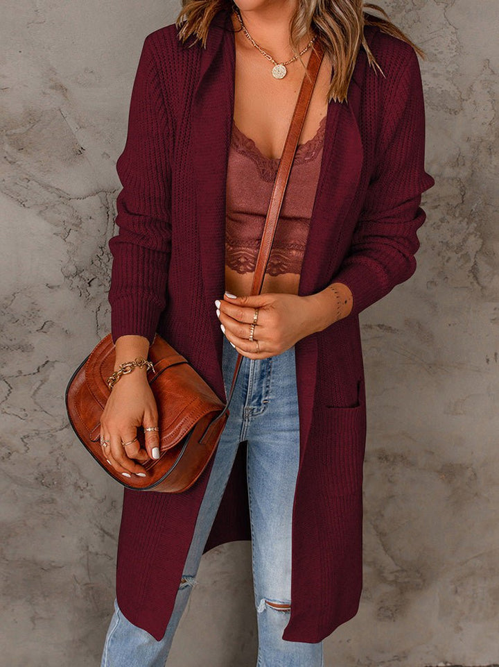 Fenwick open front long cardigan in black, close-up front view with crossbody bag