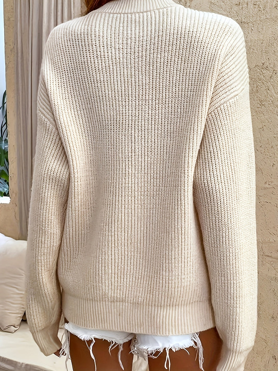 Fernanda ribbed henley pullover sweater in black, front view