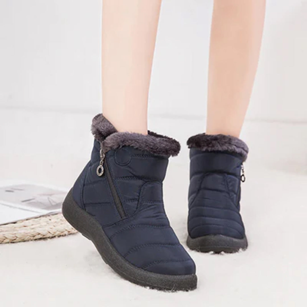 Genevieve navy snow boots worn on model, front view