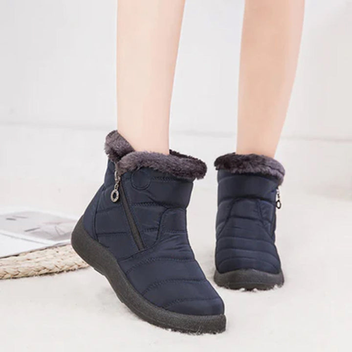 Genevieve navy snow boots worn on model, front view