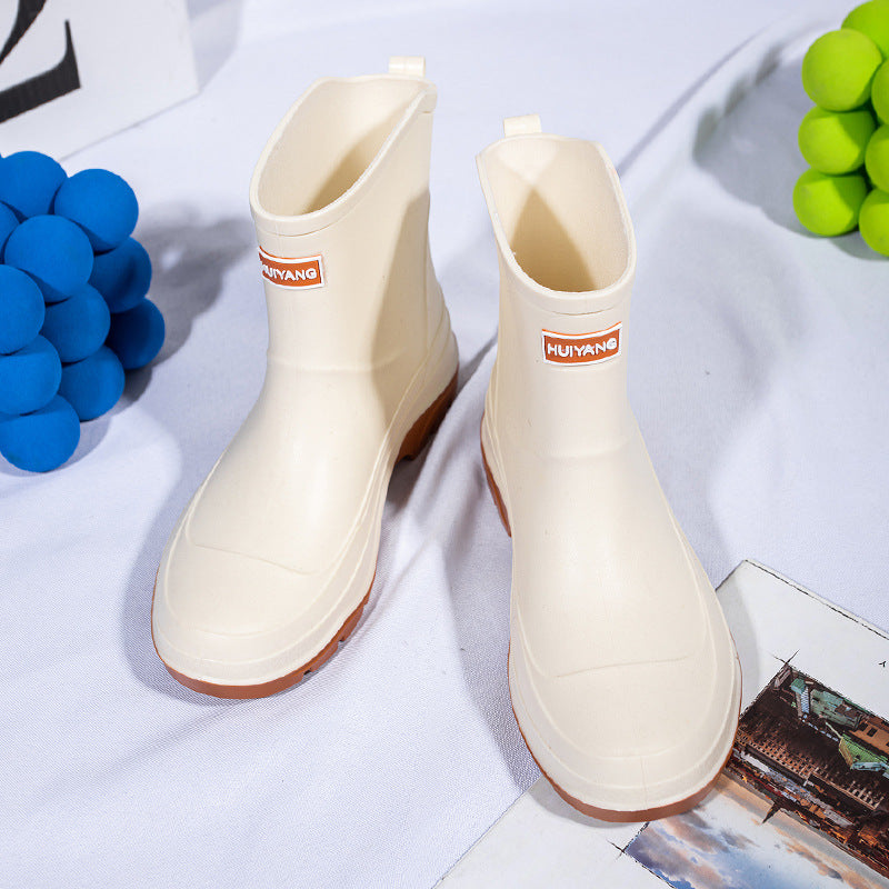 Genevieve cream rain boots with contrast sole, top angled view