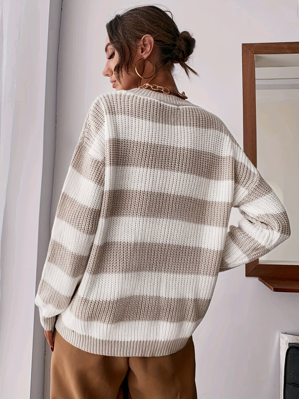 Genevieve striped sweater, back view showing relaxed fit