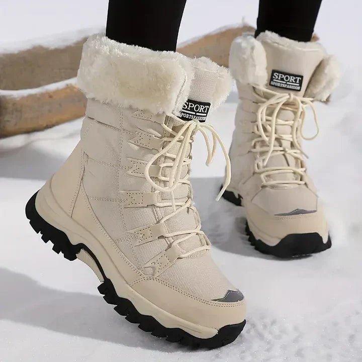 Genevieve waterproof snow boots in beige with fur trim, front angled view