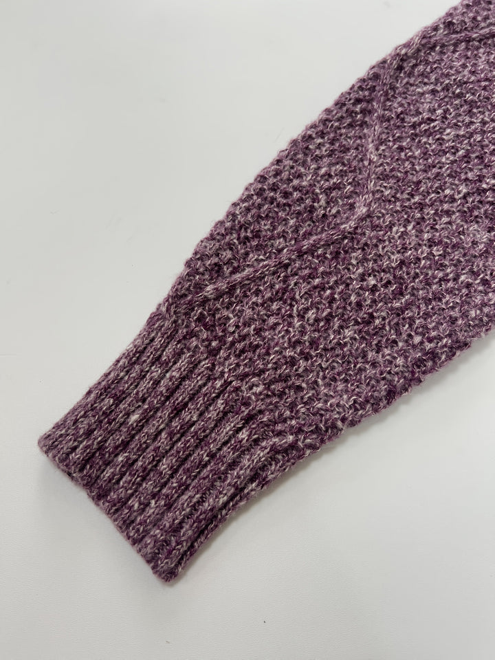 Georgette cable-knit sweater dress fabric close-up on sleeve cuff