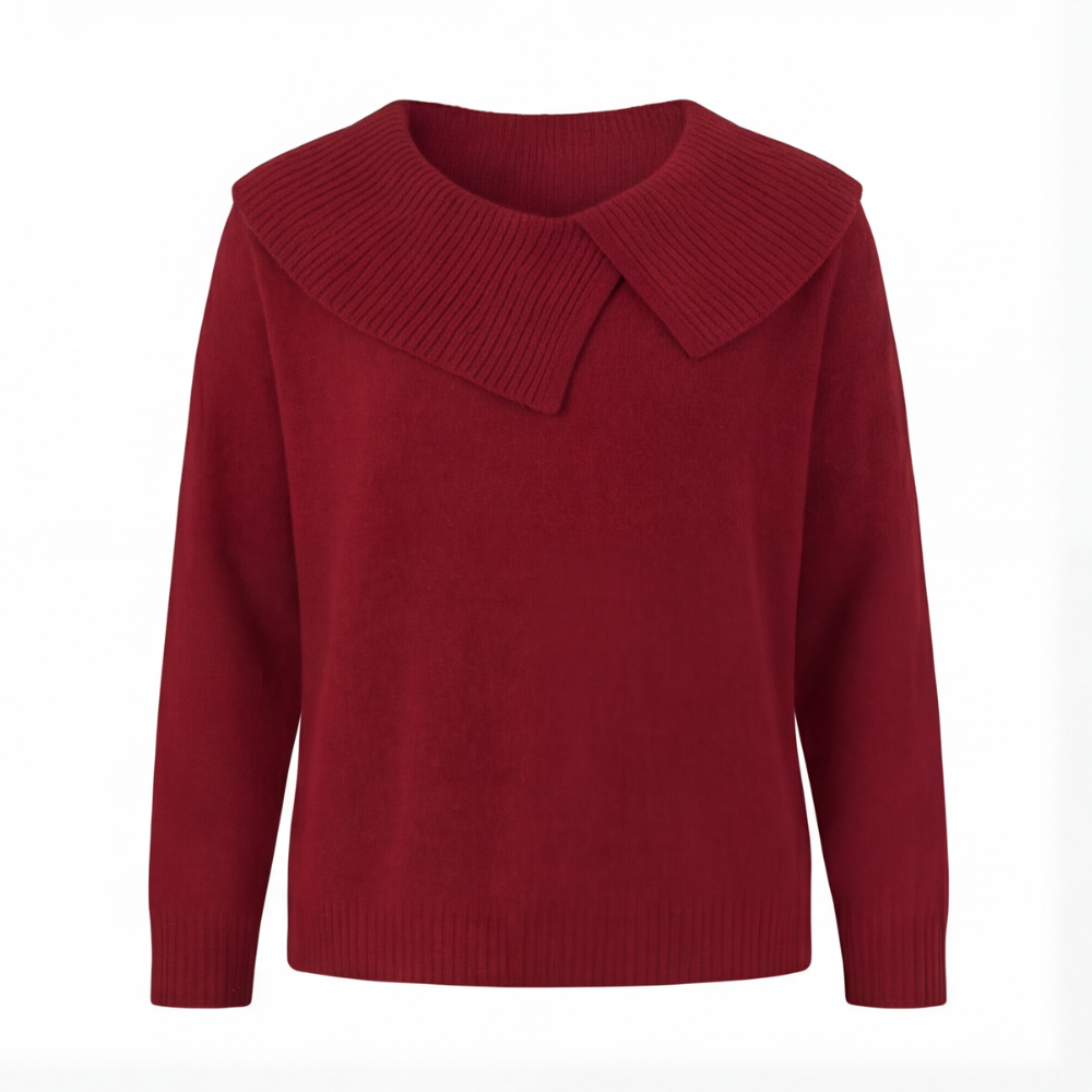 Guinevere asymmetric collar knit sweater, worn at a cafe table