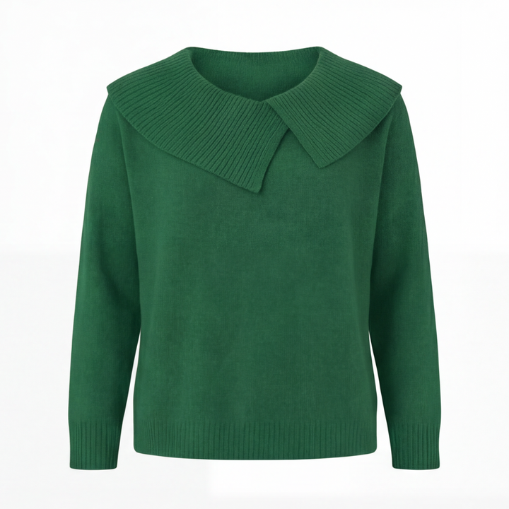 Guinevere asymmetric collar knit sweater, worn at a cafe table