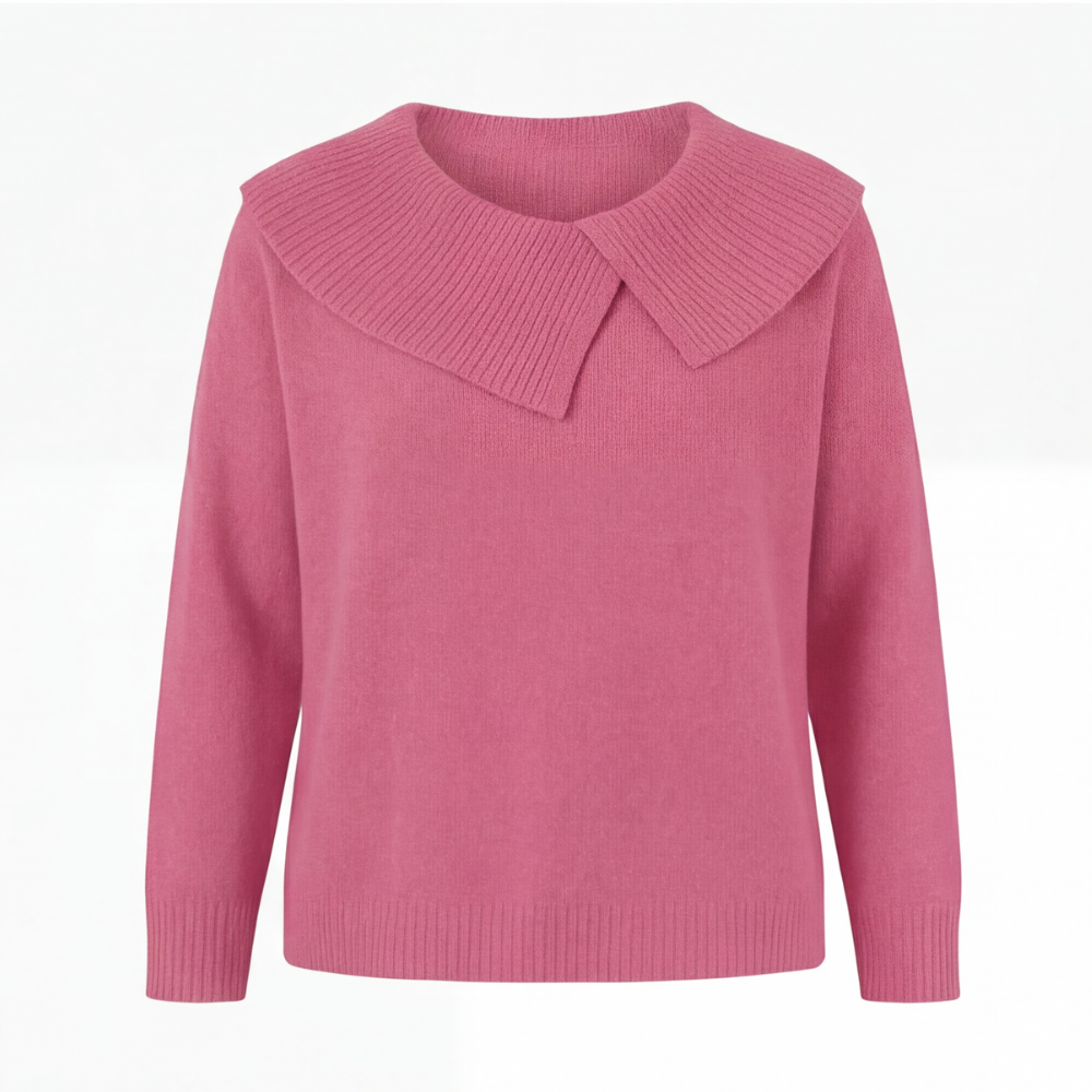 Guinevere asymmetric collar knit sweater, worn at a cafe table